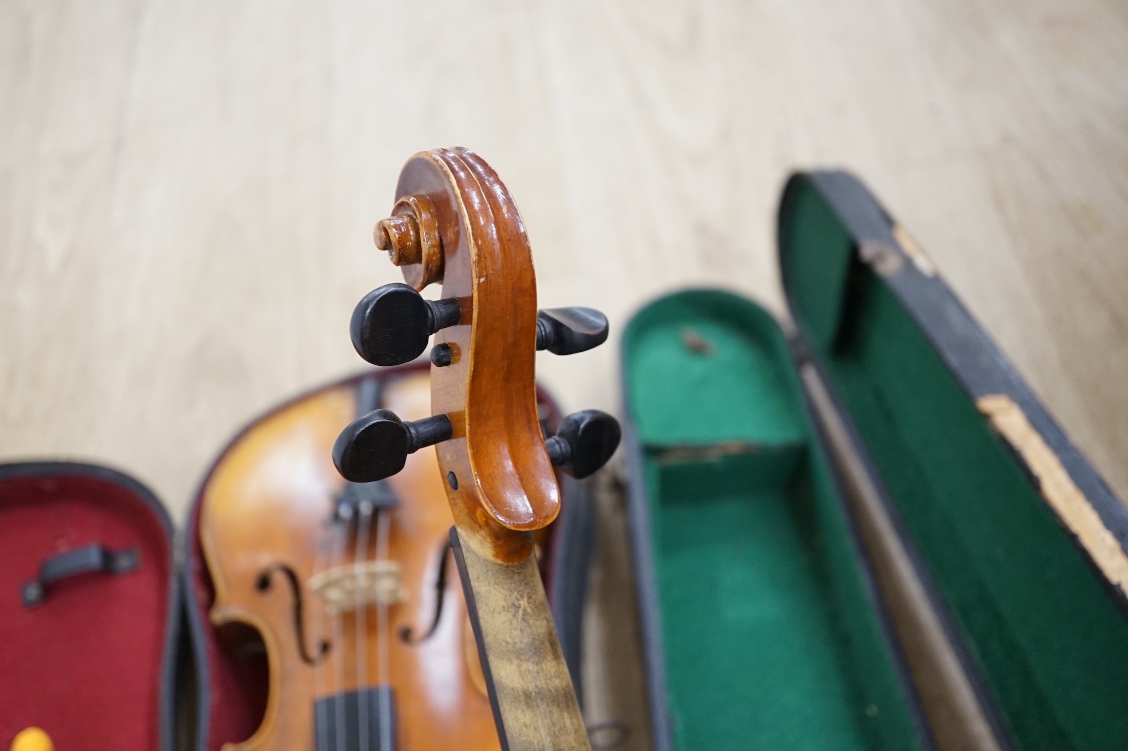 Two cased double back violins